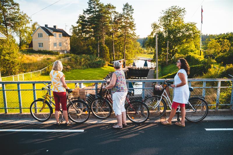 Three women with their bikes