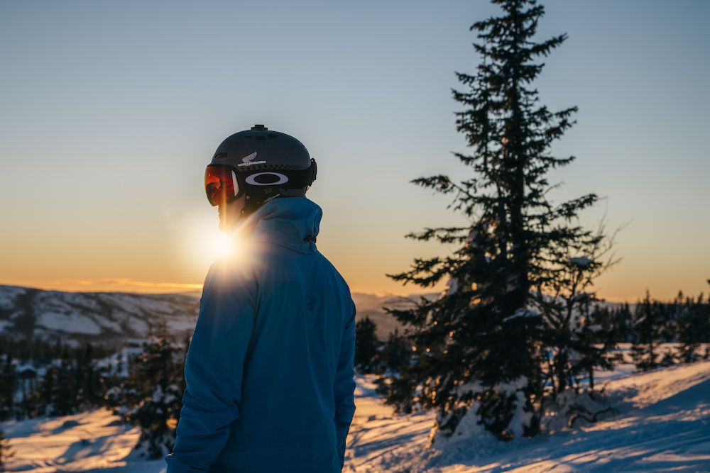 man looking at winter landscape