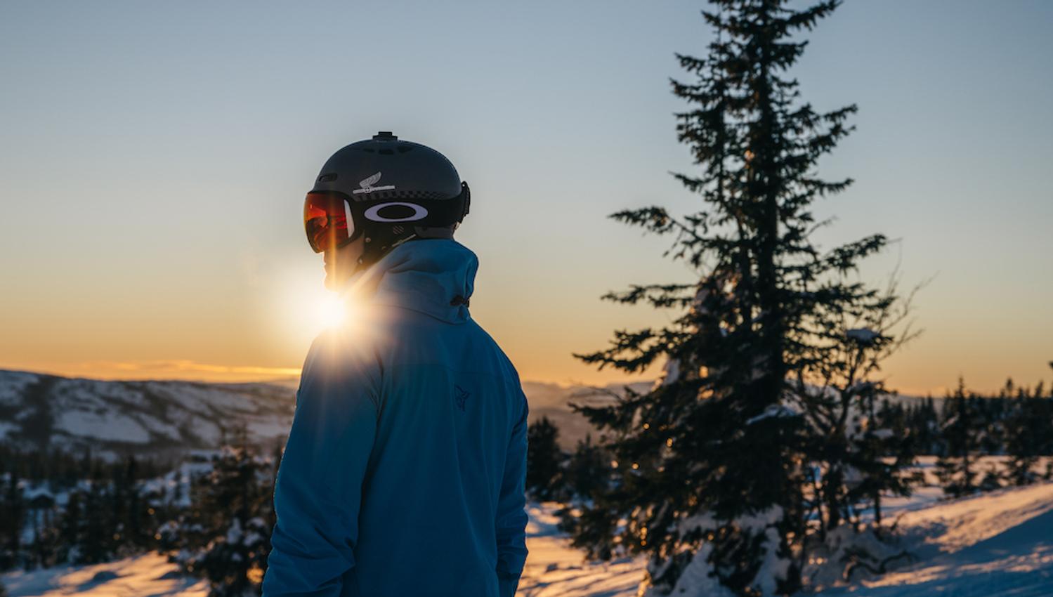 man looking at winter landscape