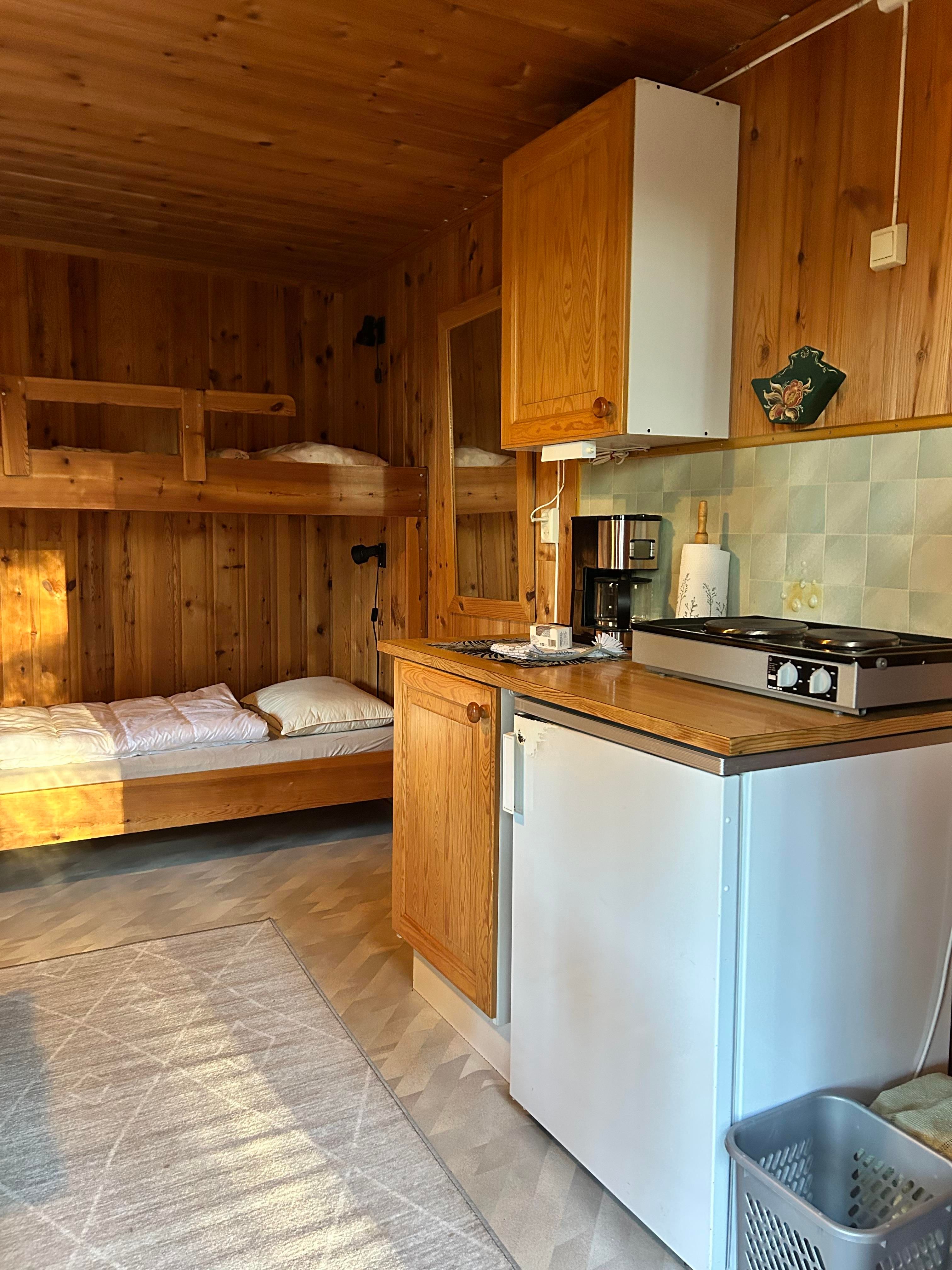 Inside the cabin, bunk bed and kitchen