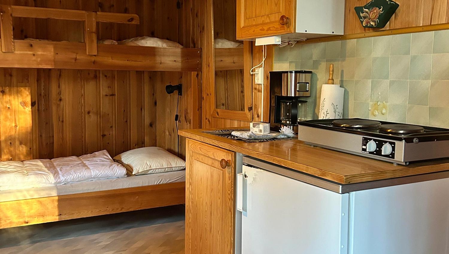 Inside the cabin, bunk bed and kitchen