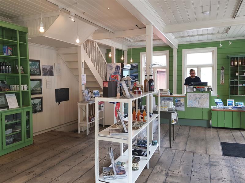 Entrance area of the souvenir shop at the Kraftmuseet, where visitors can purchase local products and informational materials.