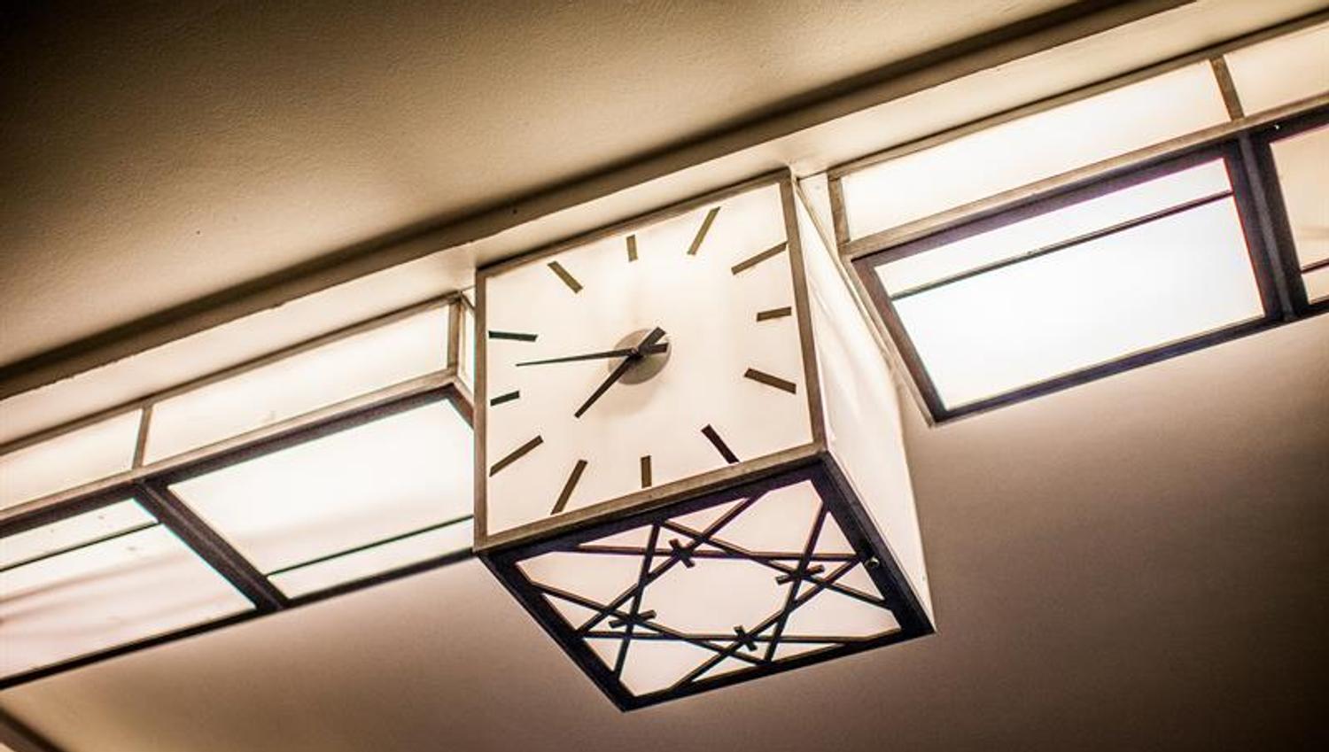 Square light clock in the ceiling, art deco style