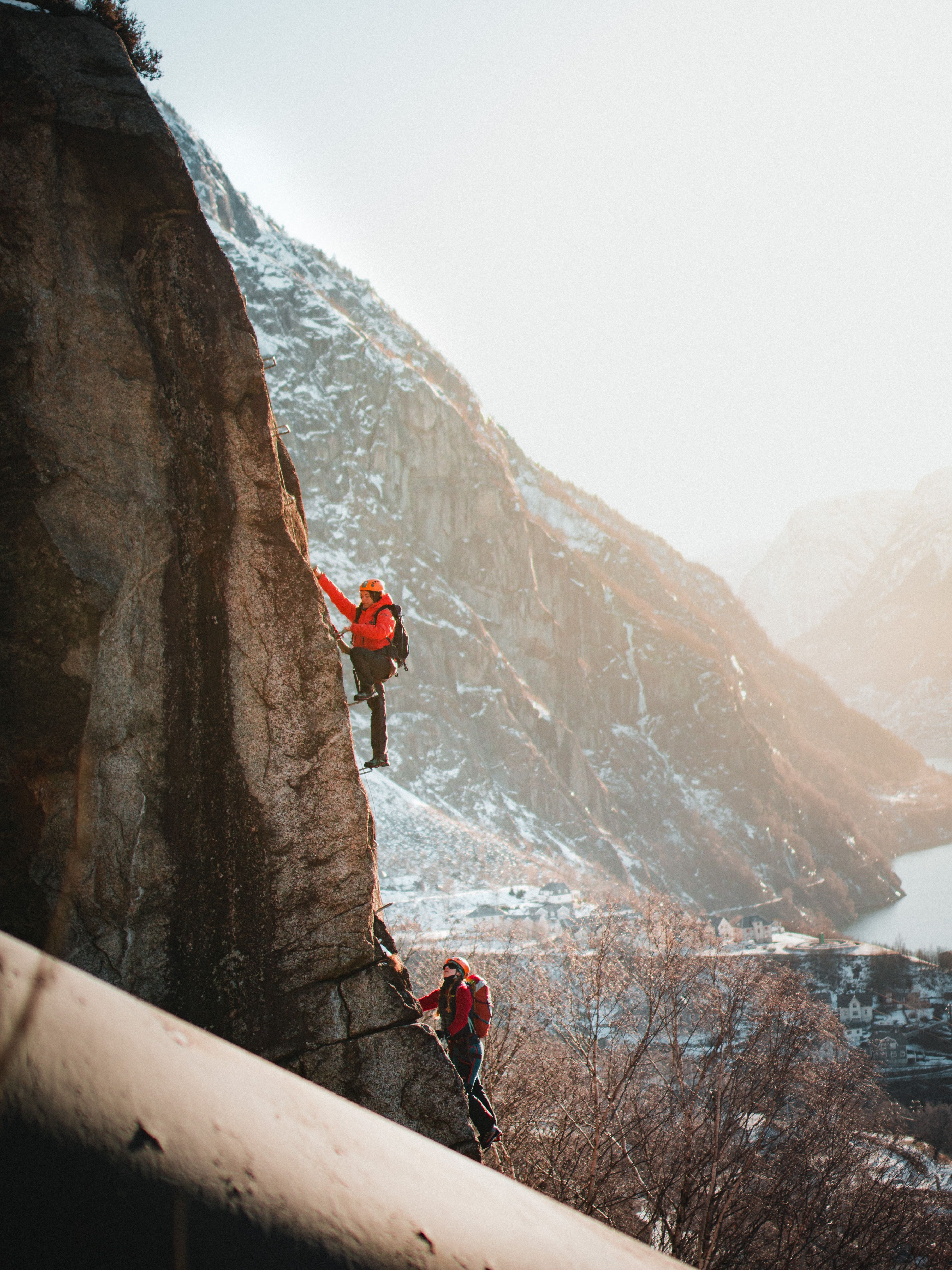 Rest stop on Via Ferrata Tyssedal in autumn colors with fjord views.