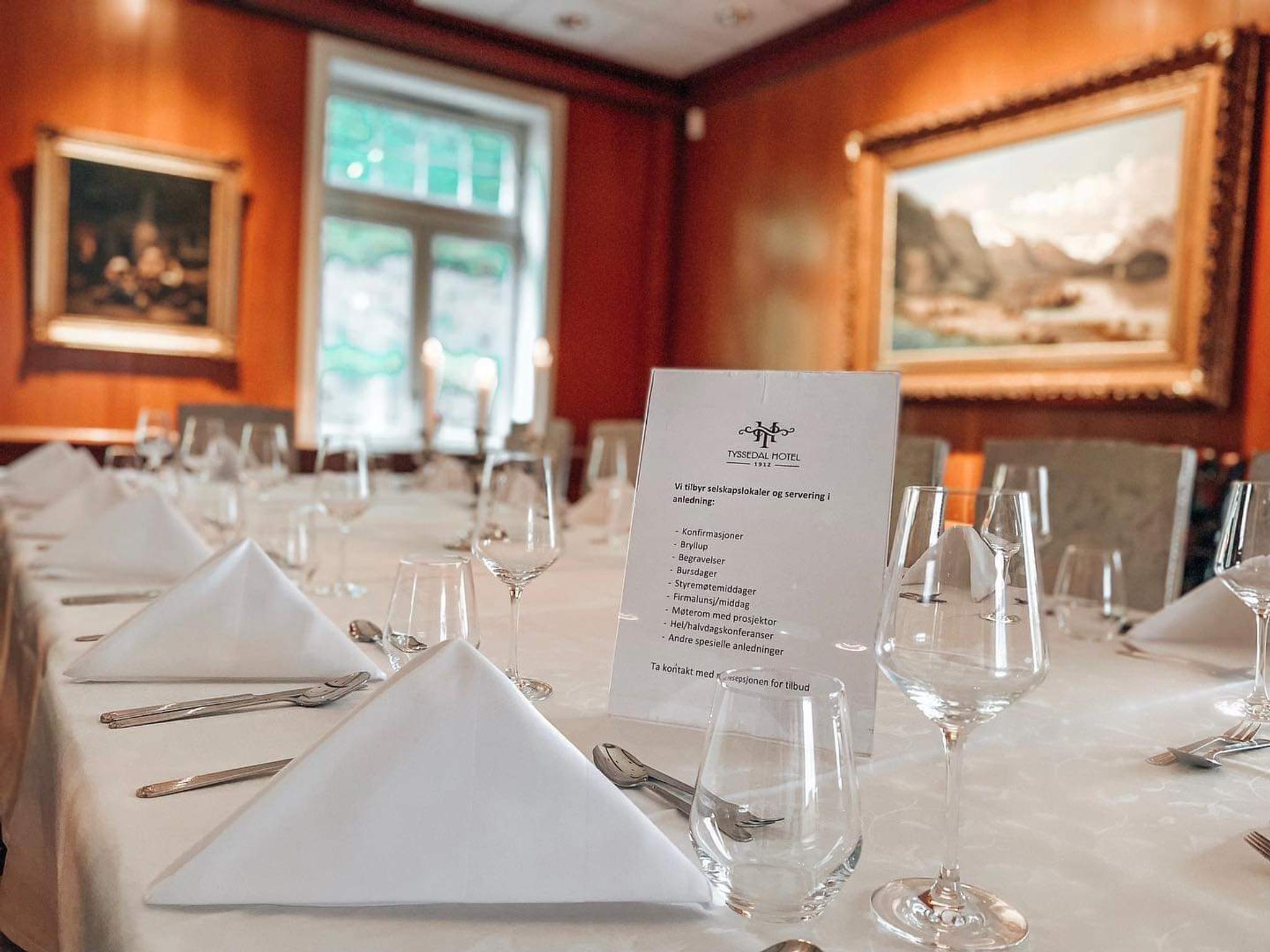 A table set for dinner with white napkins. 
