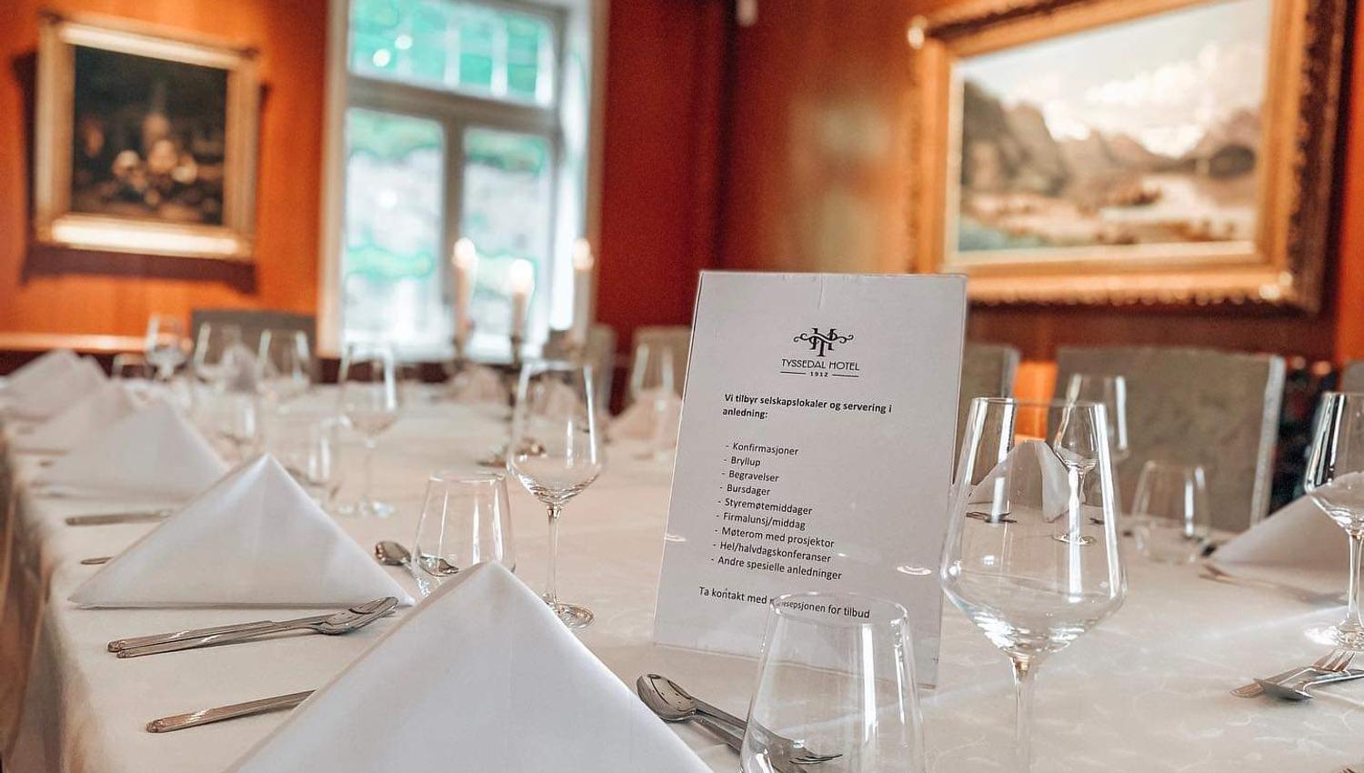 A table set for dinner with white napkins.