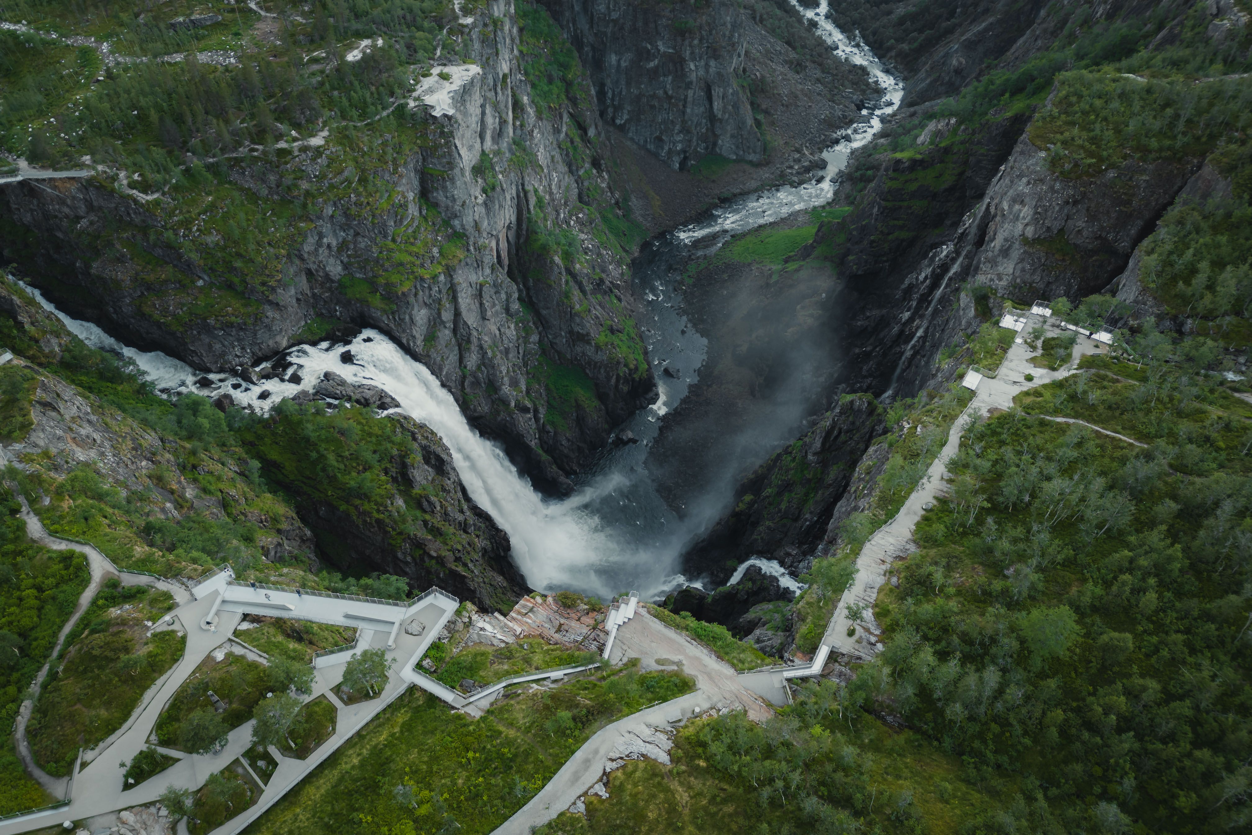 A drone photo of the viewing platforms surrounding the Vøringsfossen waterfall.
