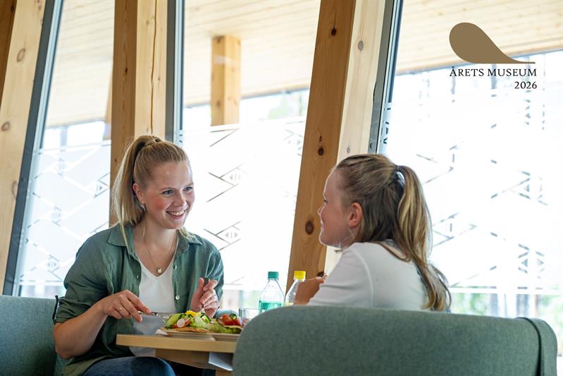 2 women enjoying Sami food in the museum cafe