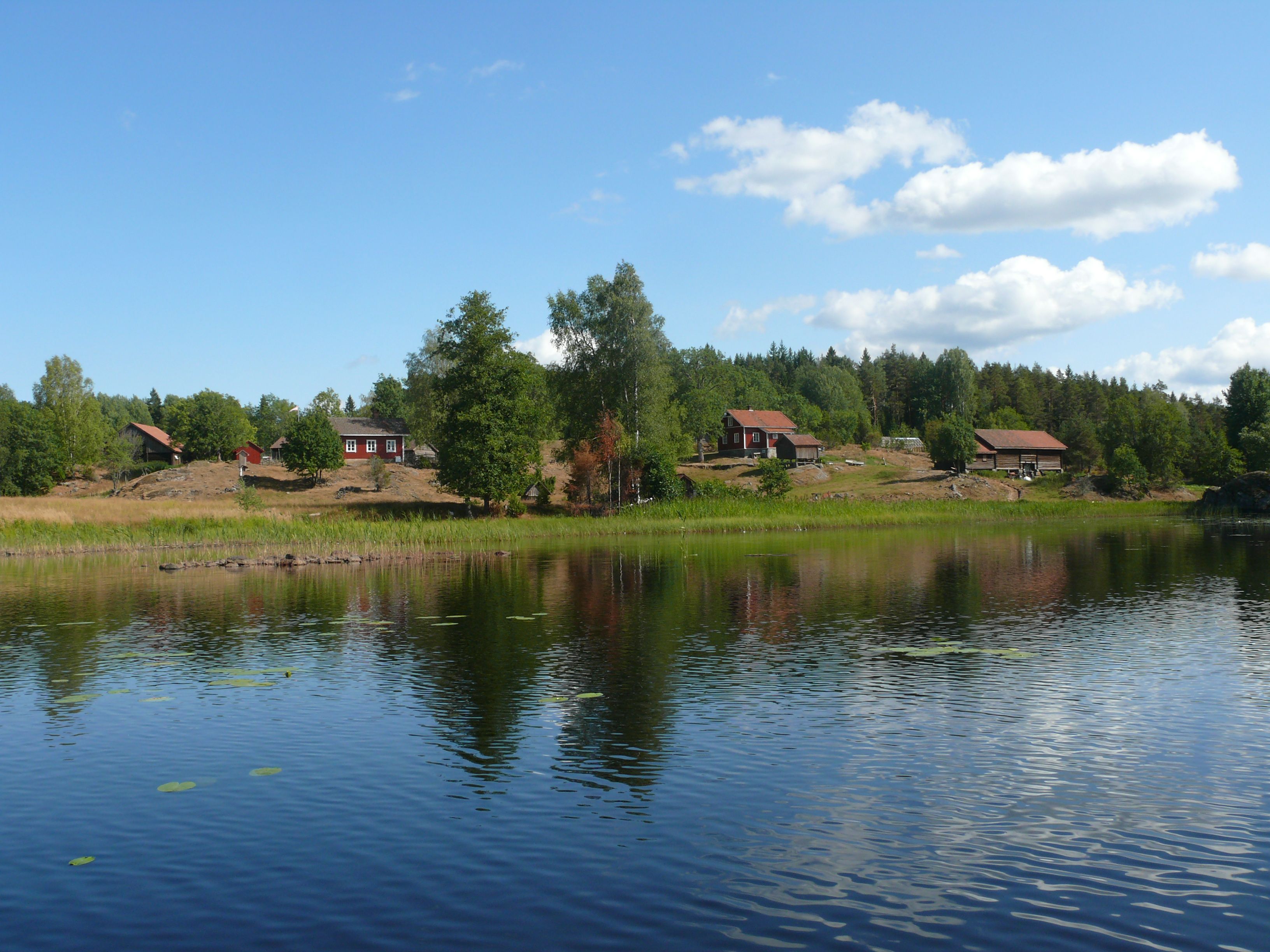 a small farm by a lake