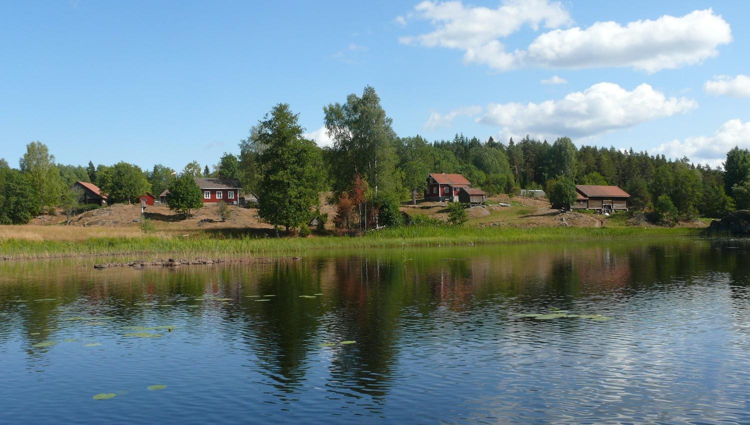a small farm by a lake