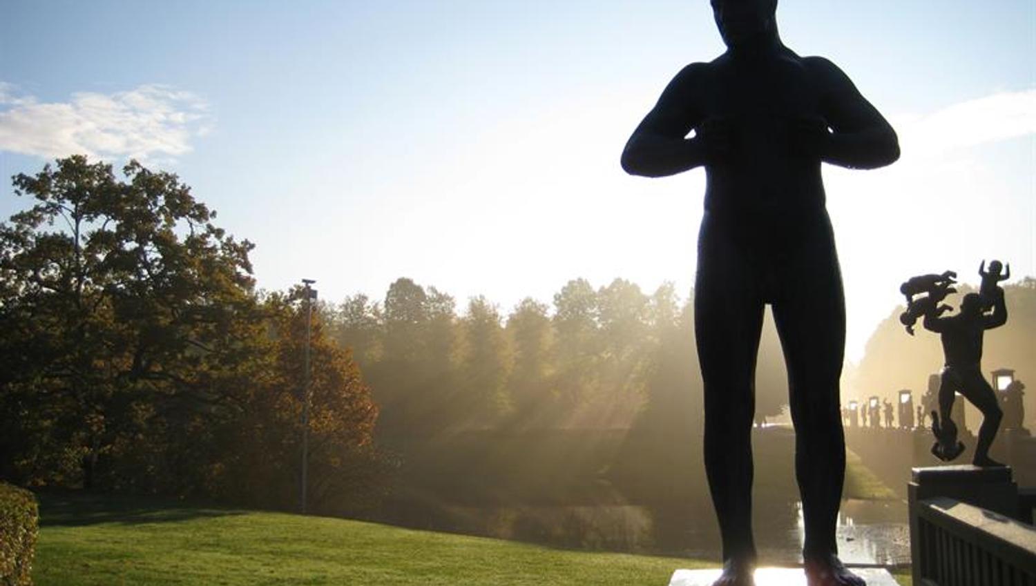 Statue of man in morning light.