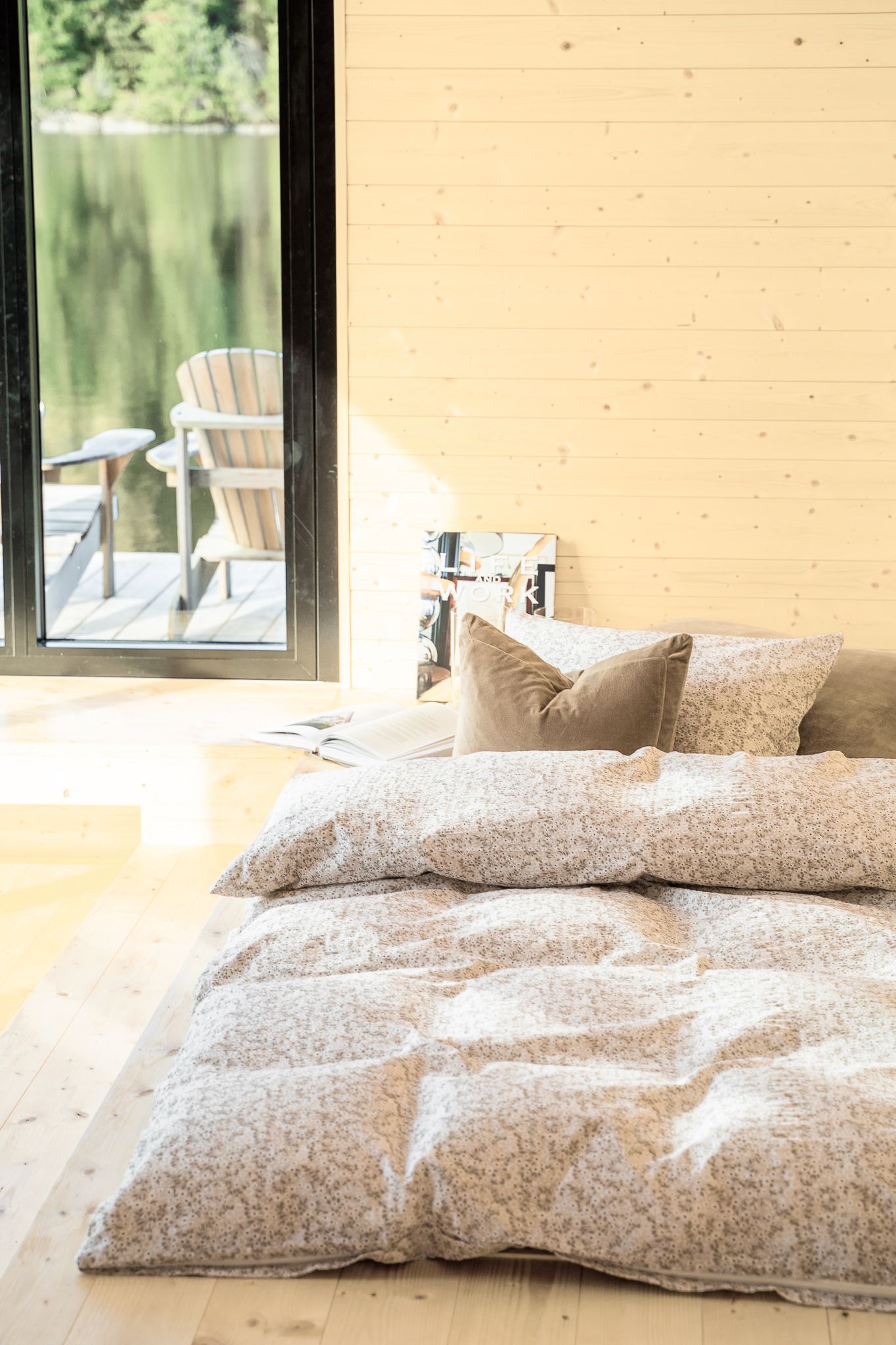Bed by water by window