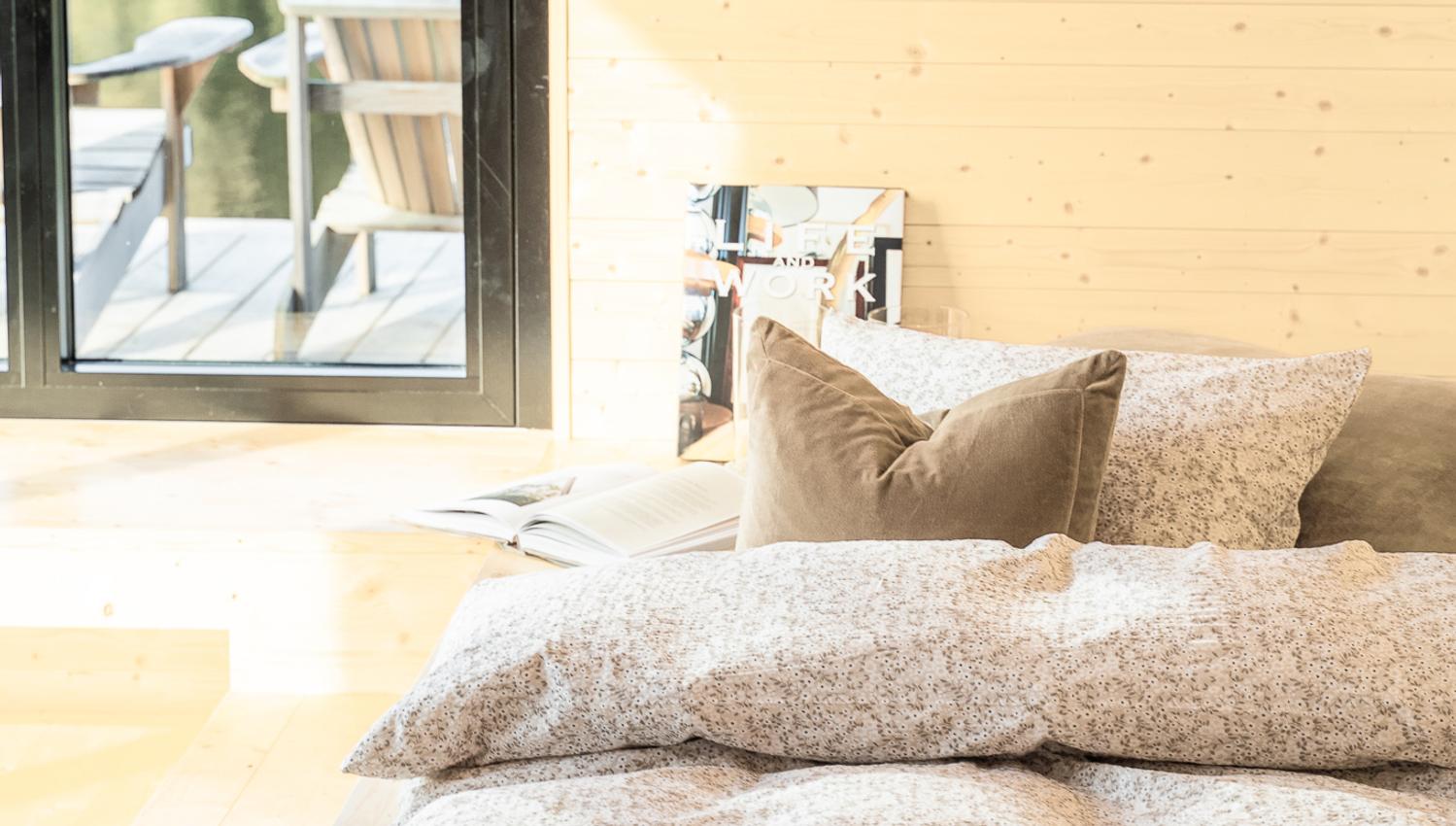 Bed by water by window