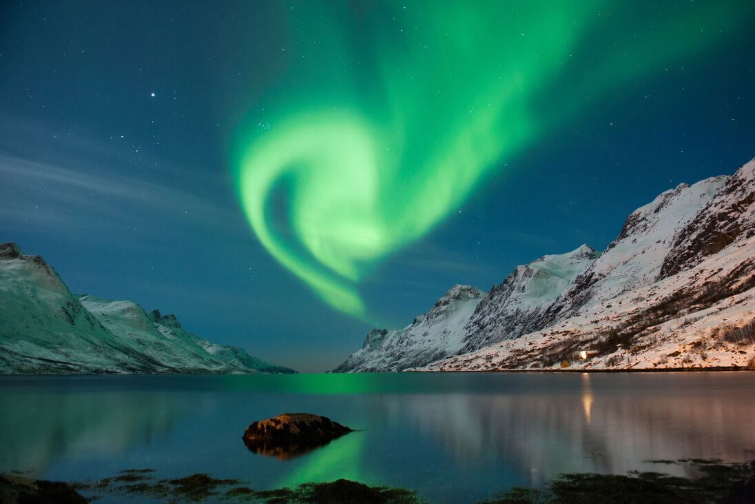 Northern lights and mountains near Tromsø