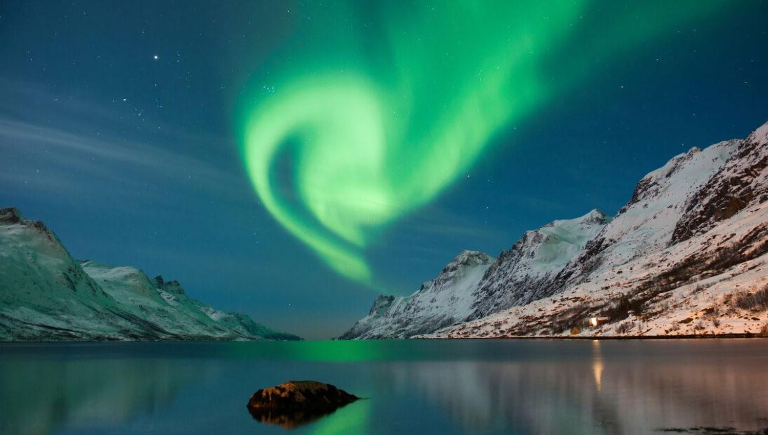 Northern lights and mountains near Tromsø