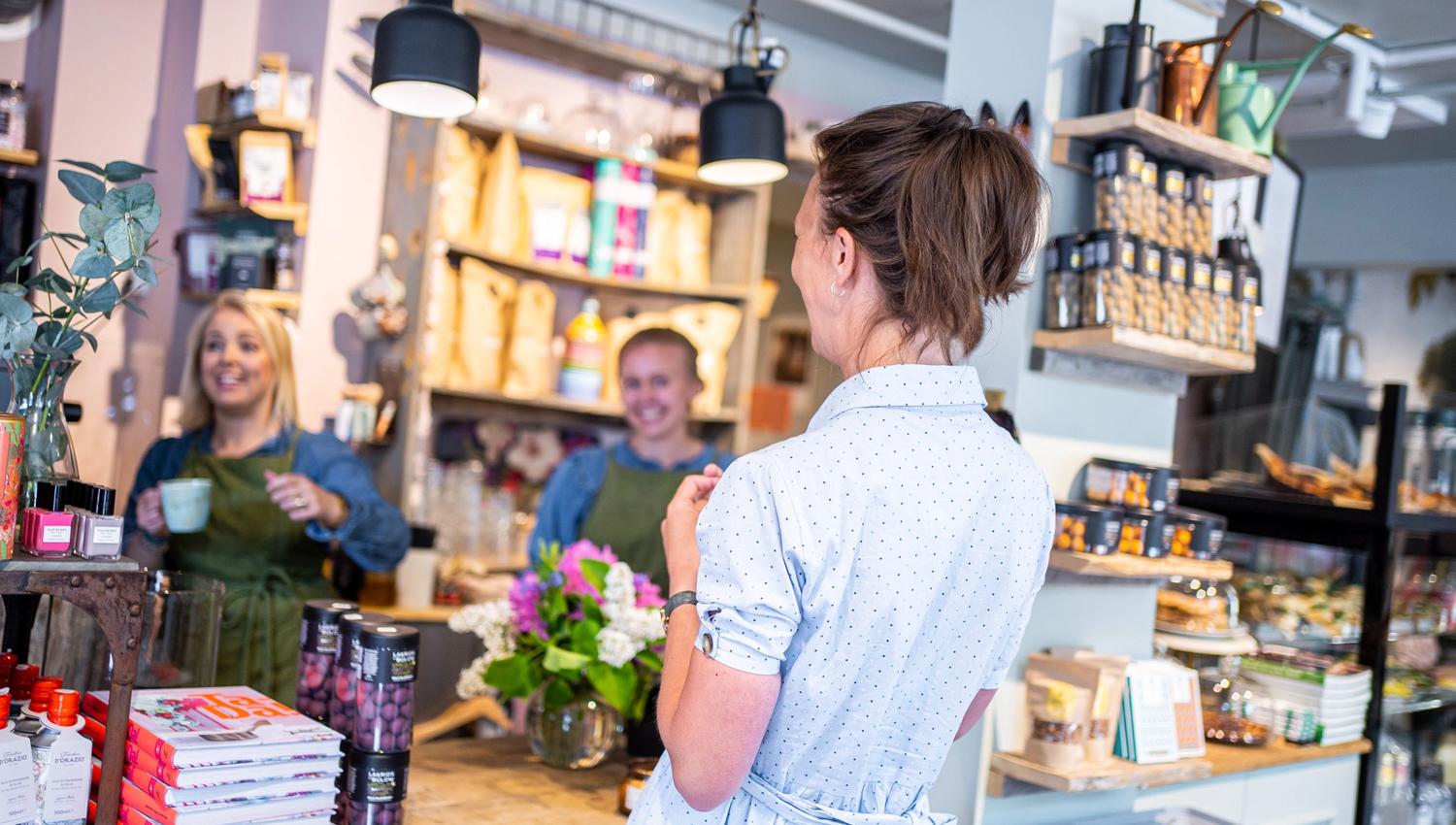 customer and workers at a store