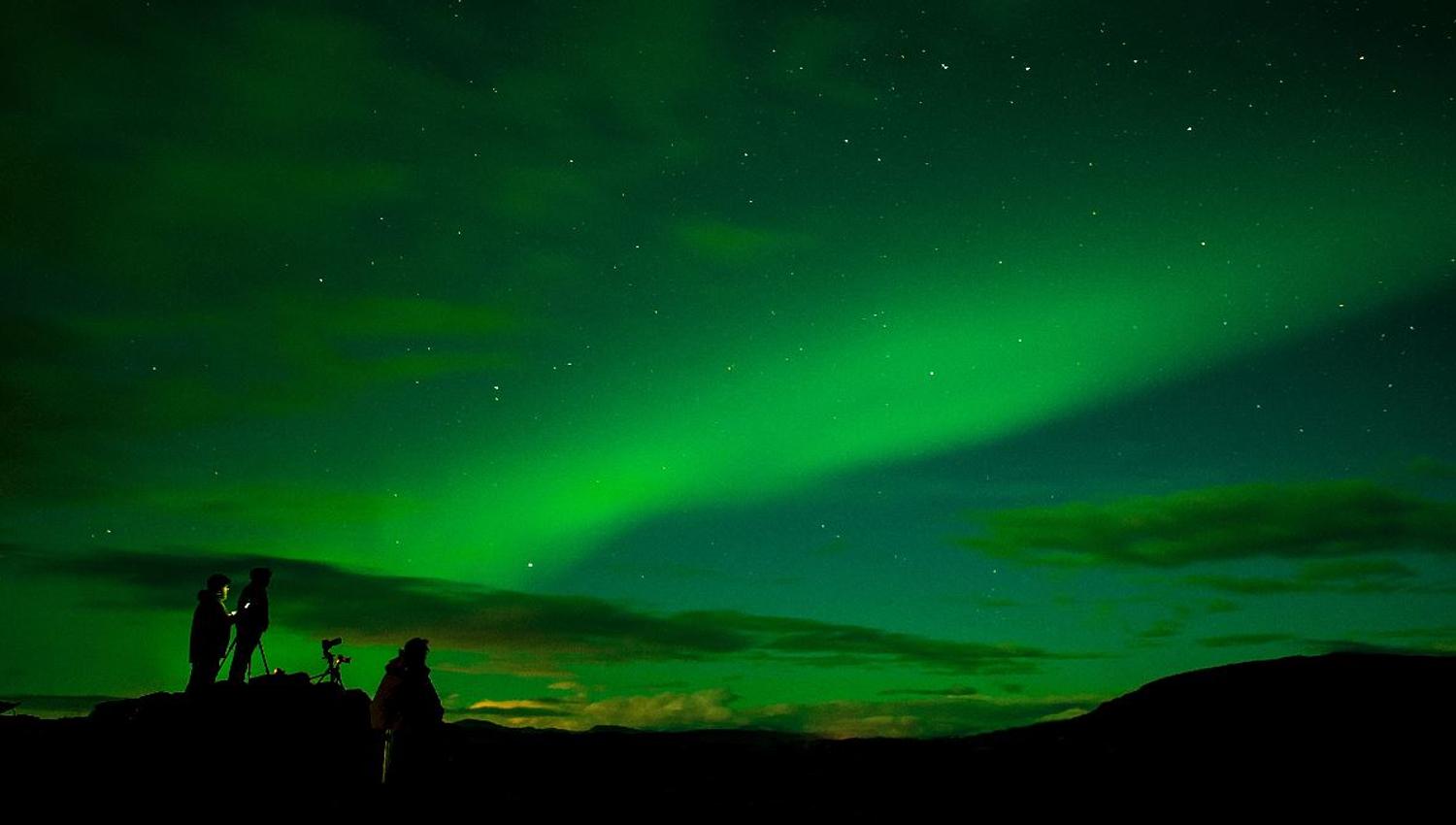 A group enjoying the northern lights