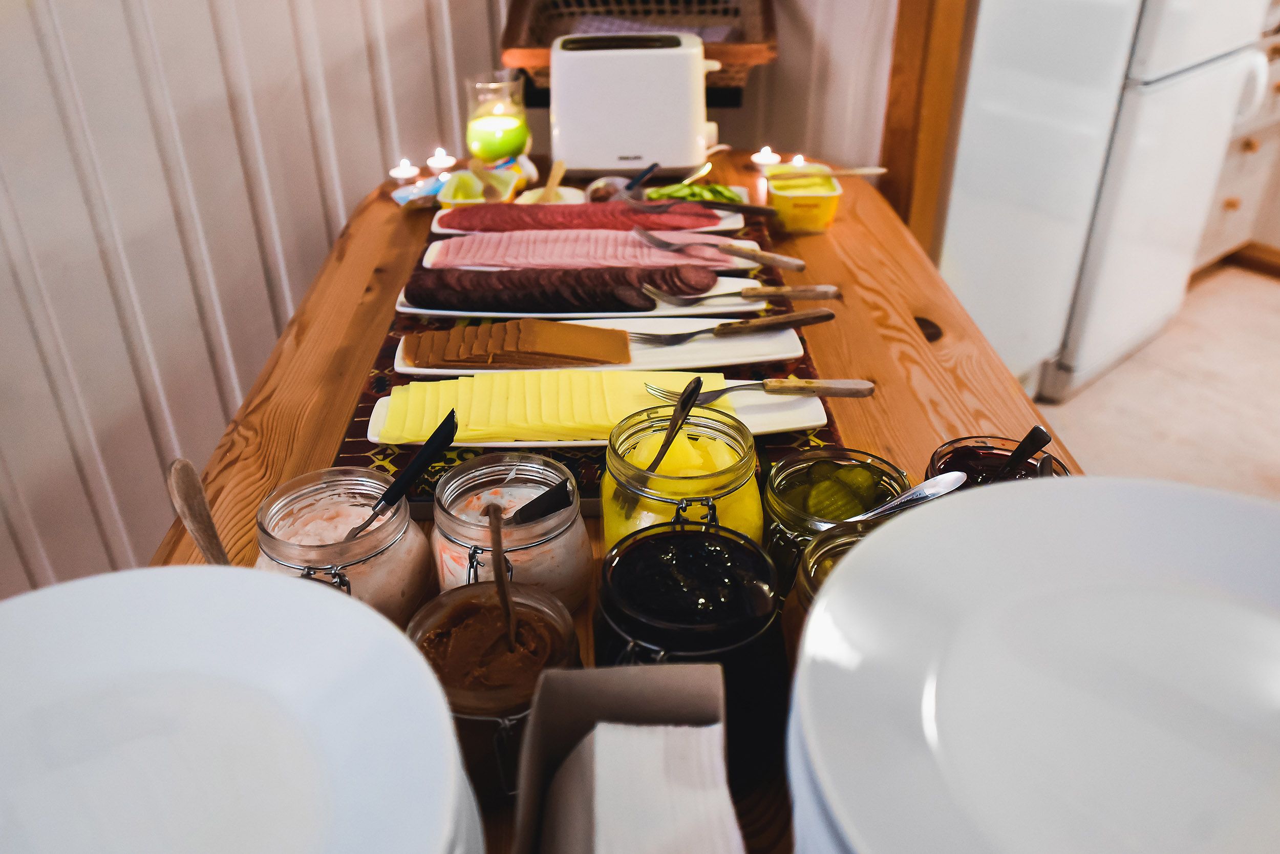 A breakfast buffet with food and plates