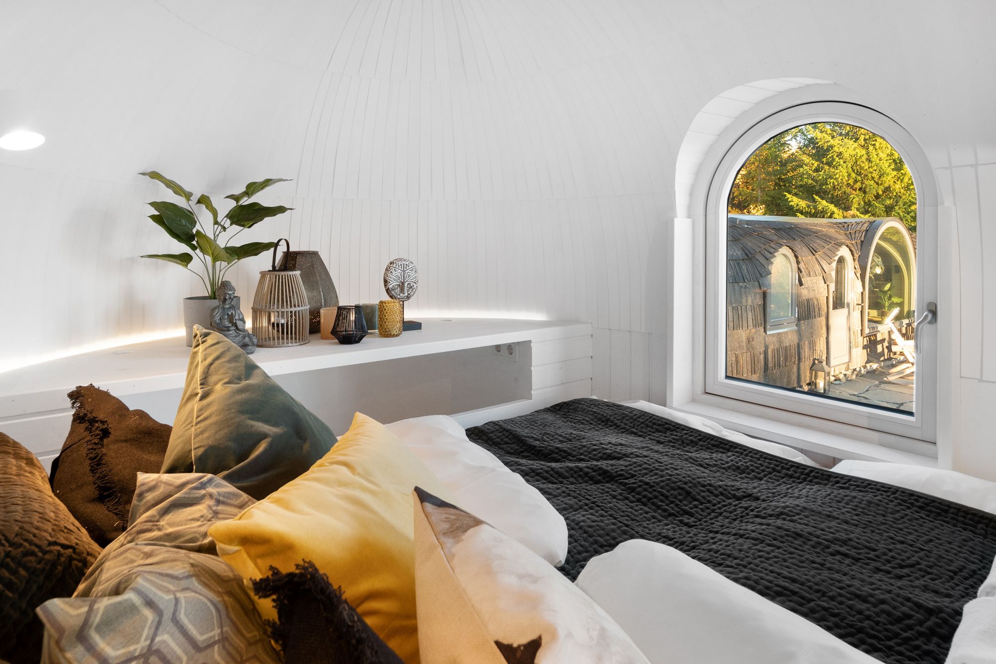 bed with pillows and a window 