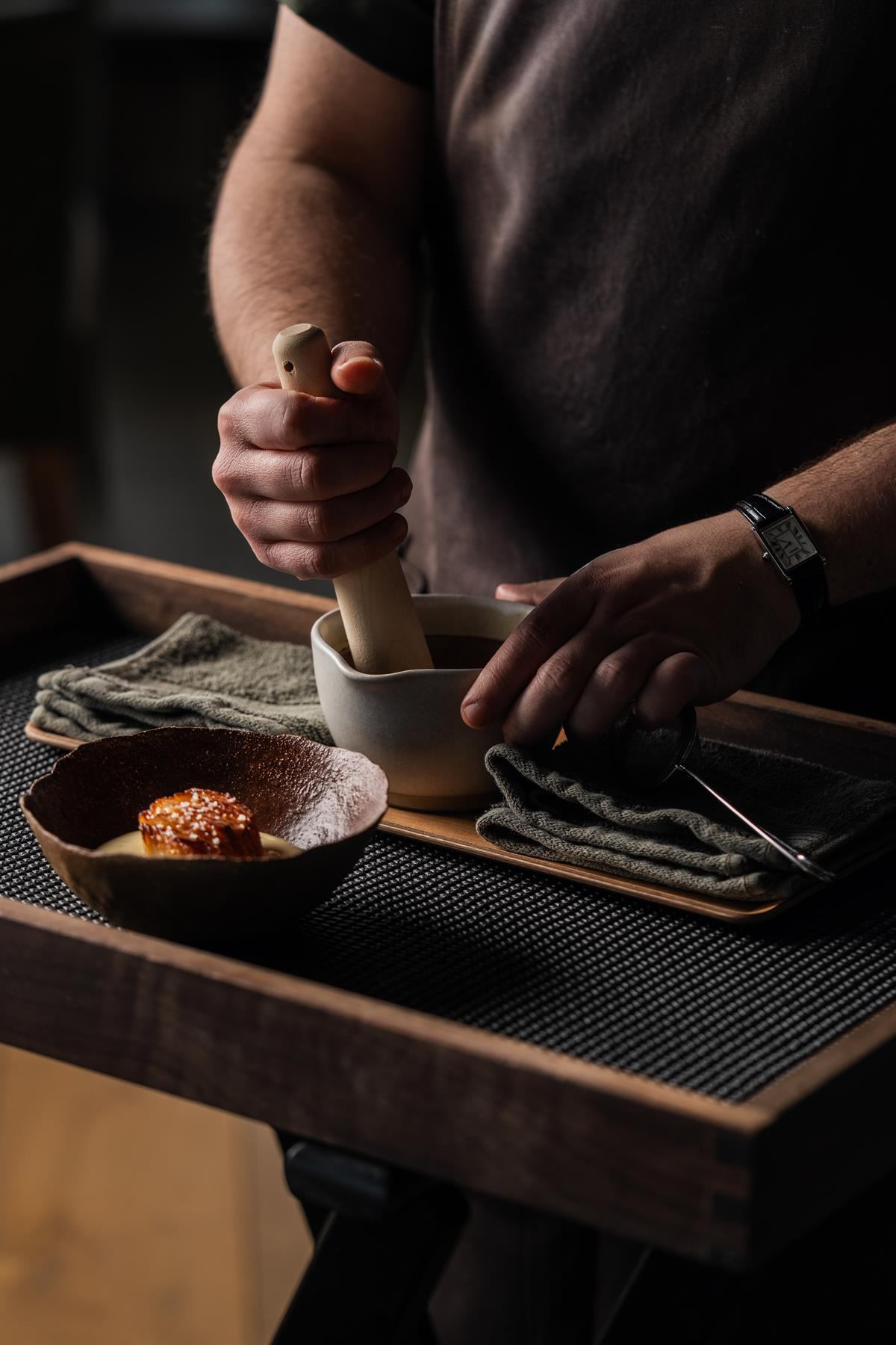 Chef preparing food in the kitchen.