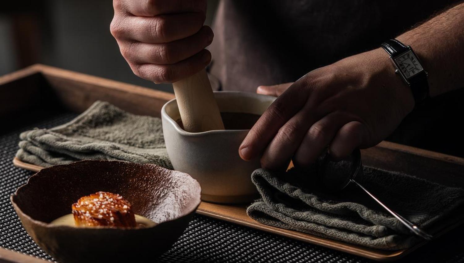 Chef preparing food in the kitchen.