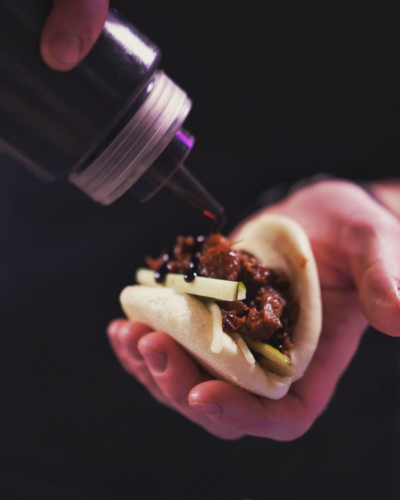 Chef presenting a prepared dish