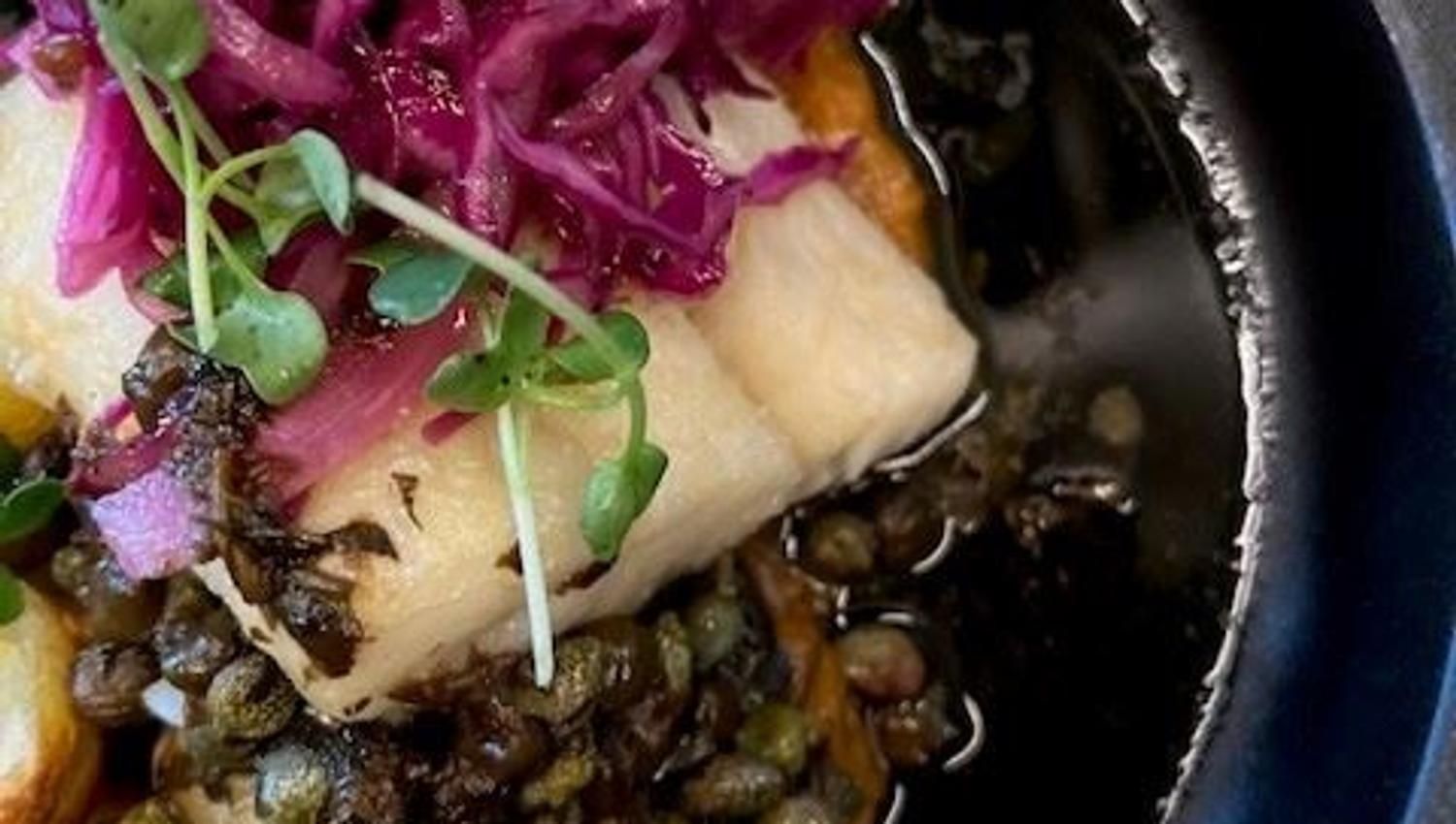 Fish gratin served with vegetables and potatoes