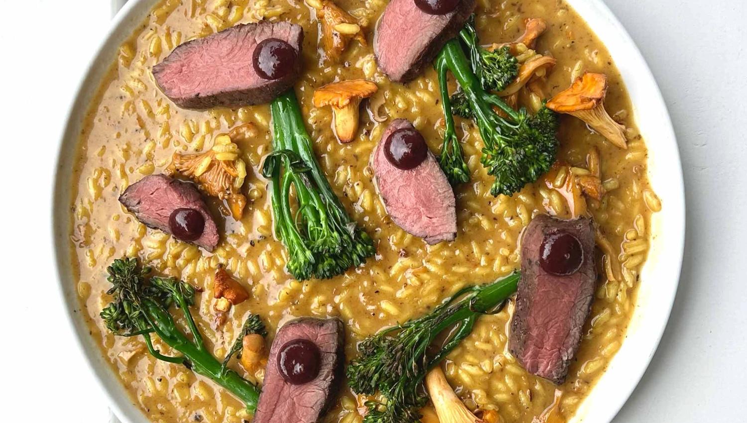 A gourmet risotto dish at Vik Restaurant, Bakeri & Kafé, served with broccolini and chanterelles.