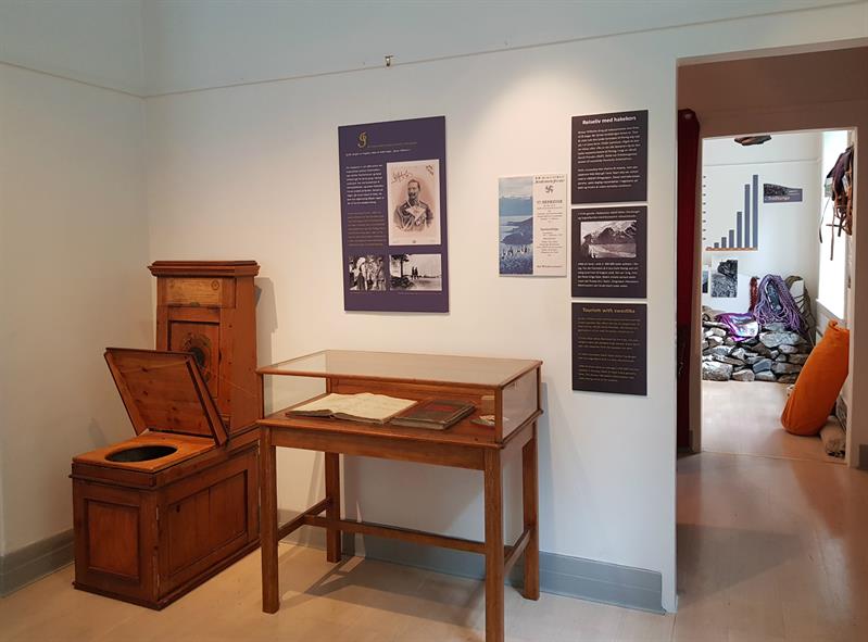 Historical room at the Kraftmuseet showcasing old documents and furniture related to the power station's history.