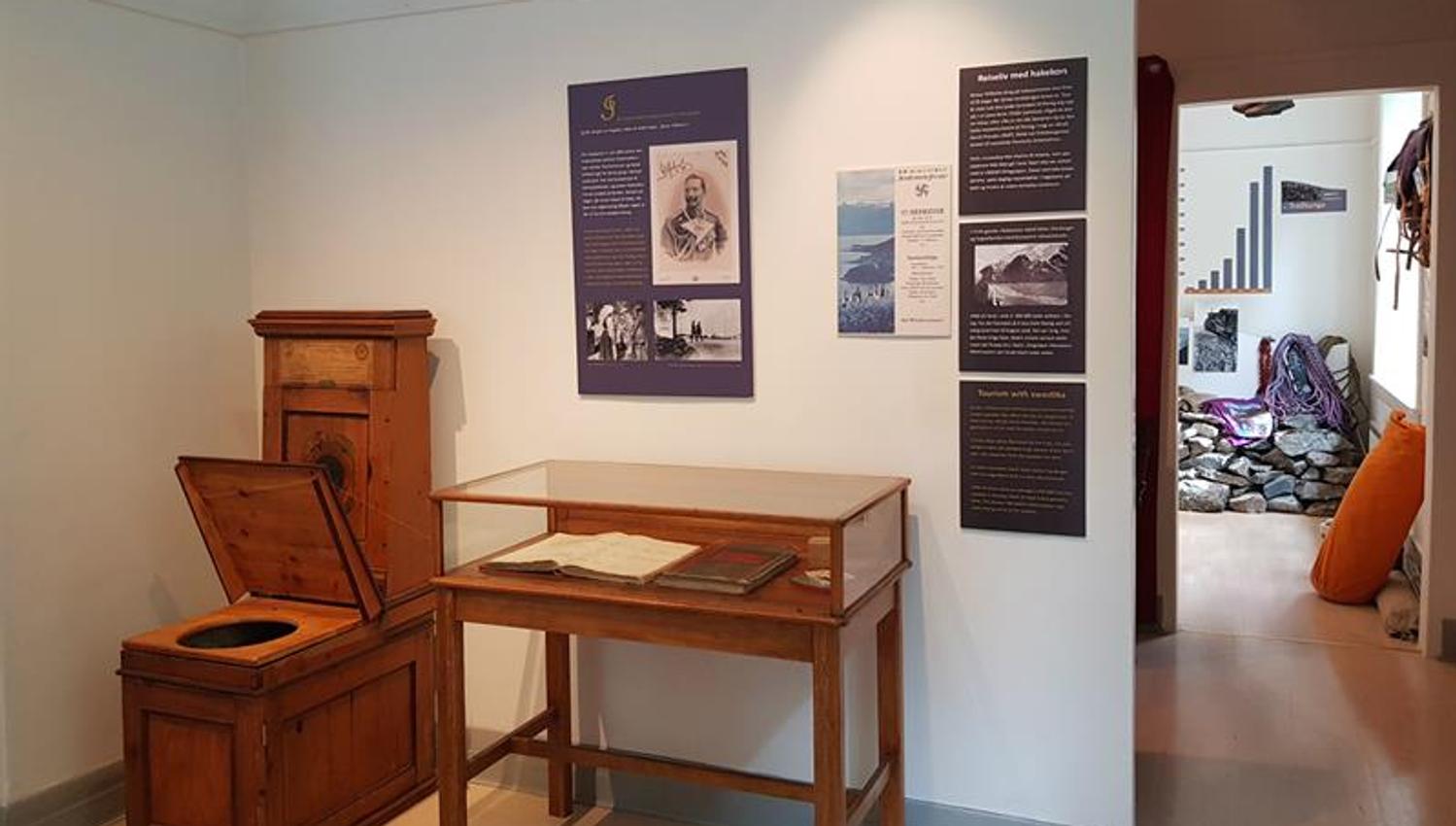 Historical room at the Kraftmuseet showcasing old documents and furniture related to the power station's history.