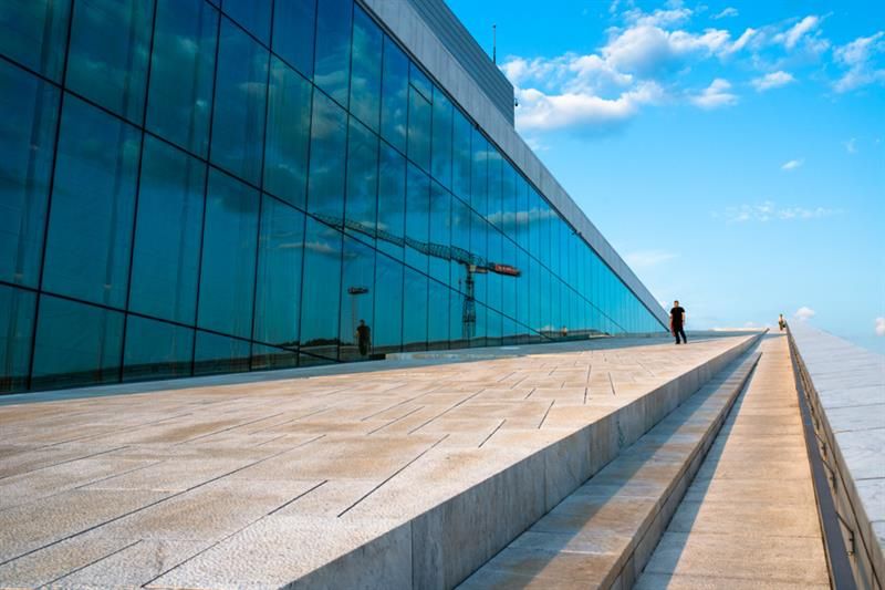 Exterior photo of the opera with the big glass windows on the left hand side.