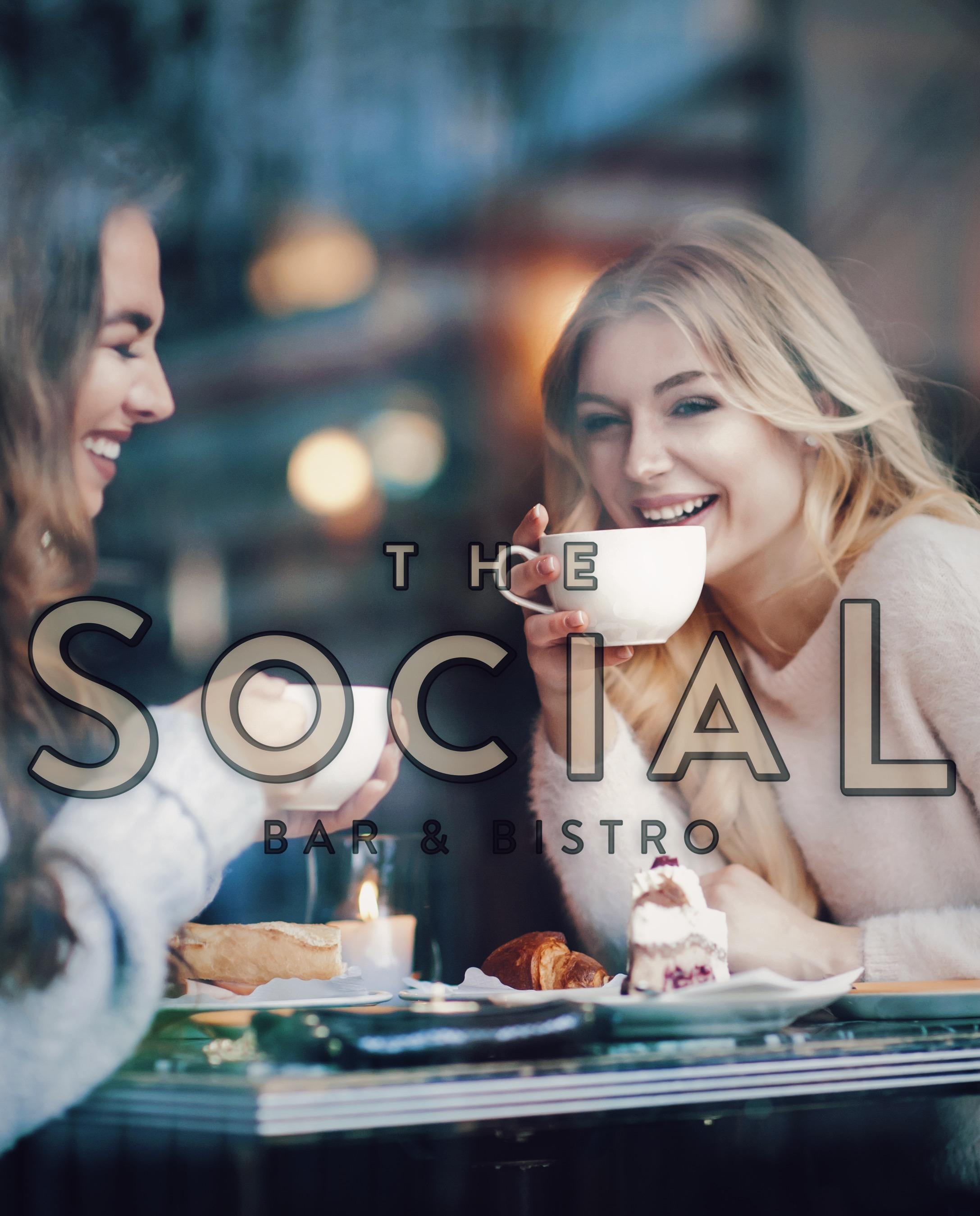 Two girls drinking coffee