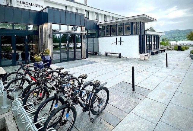 bicycles parked in front of a hotel 