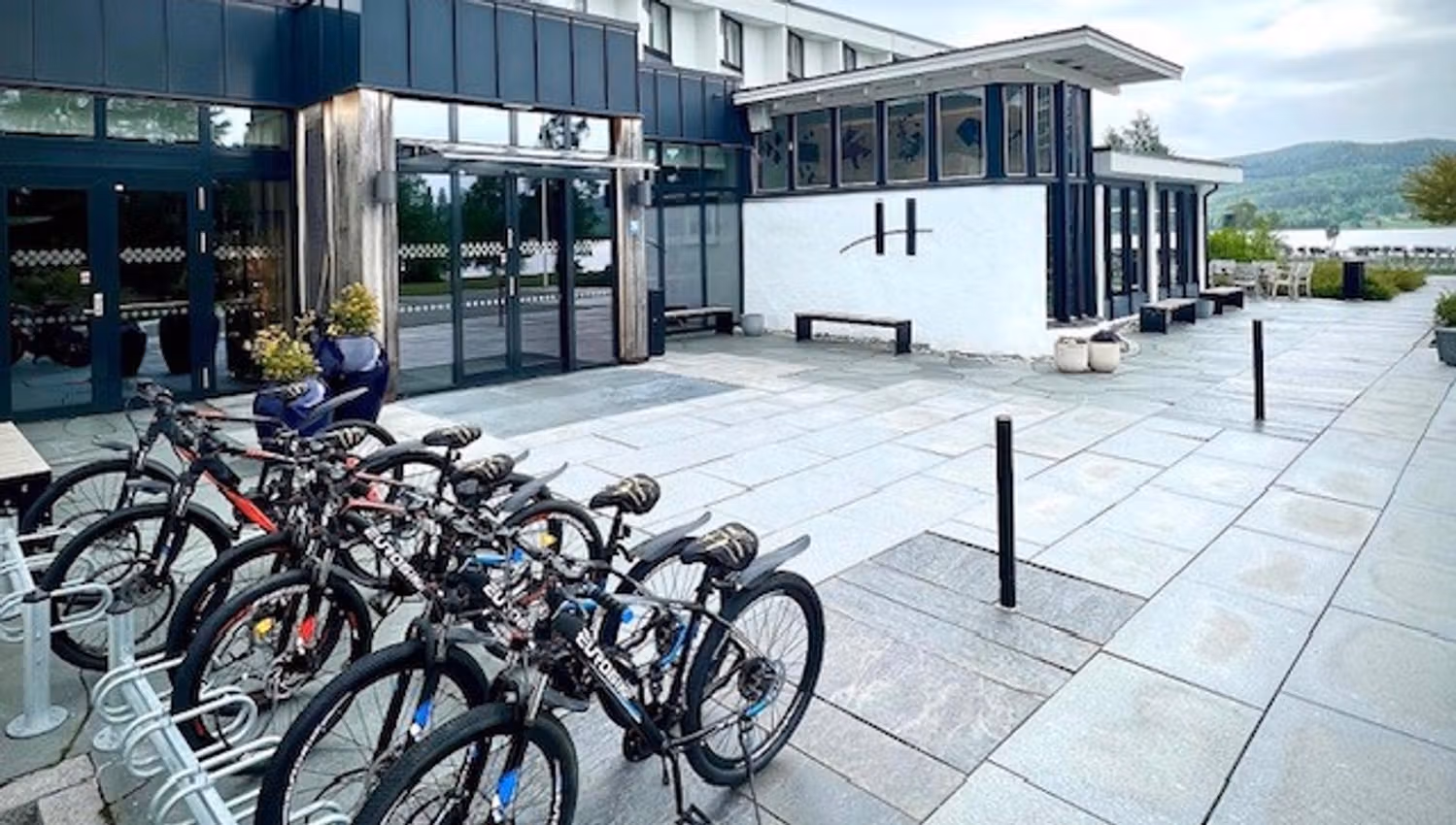 bicycles parked in front of a hotel