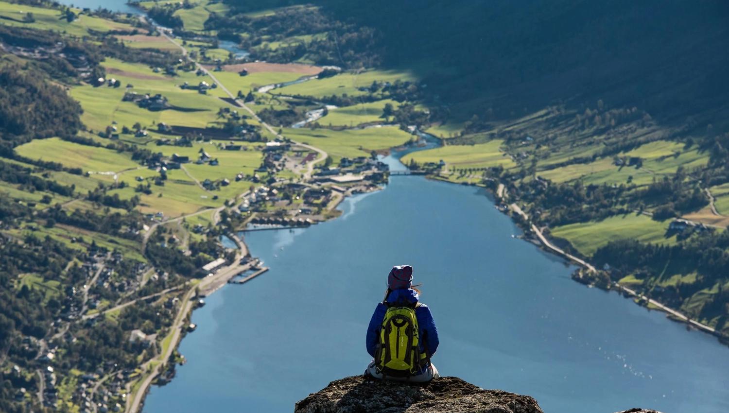 View from Hoven towards Nordfjord, with the fjord, mountains and settlements visible below.