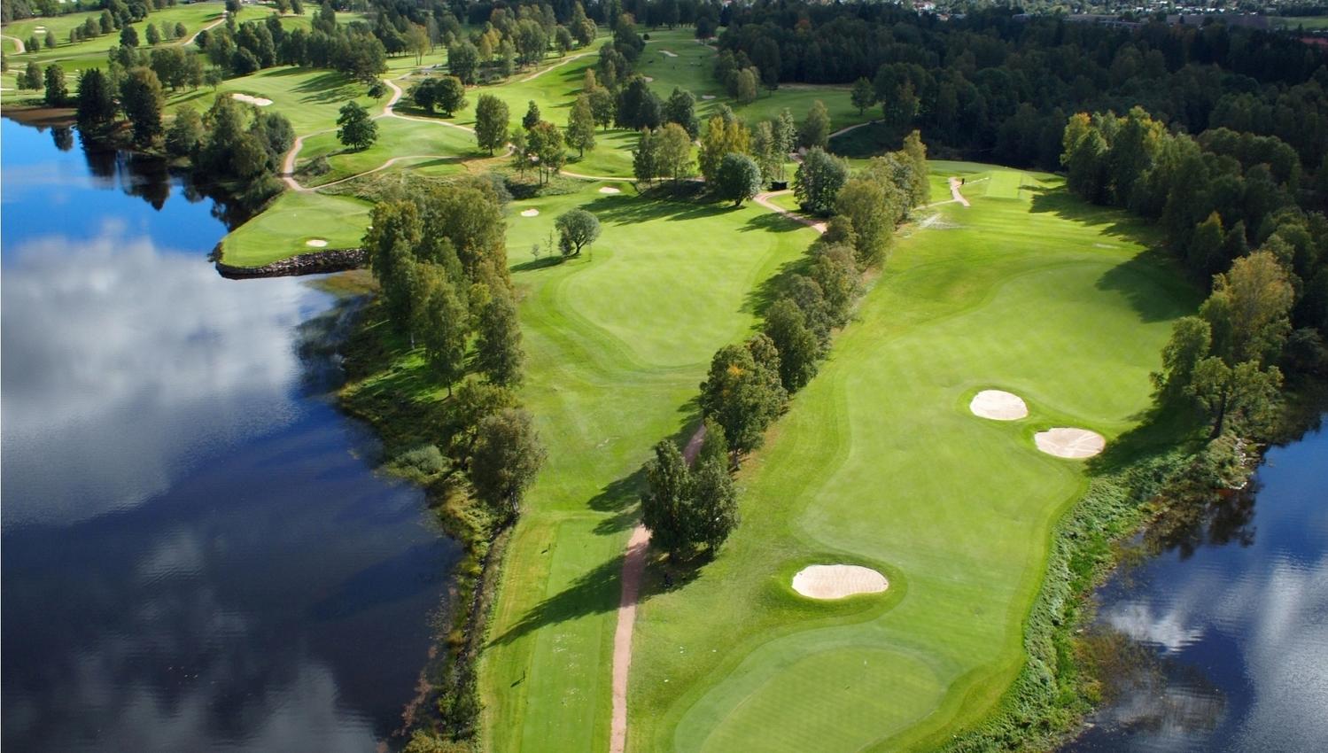aerial view of the golf course surrounded by the fjord