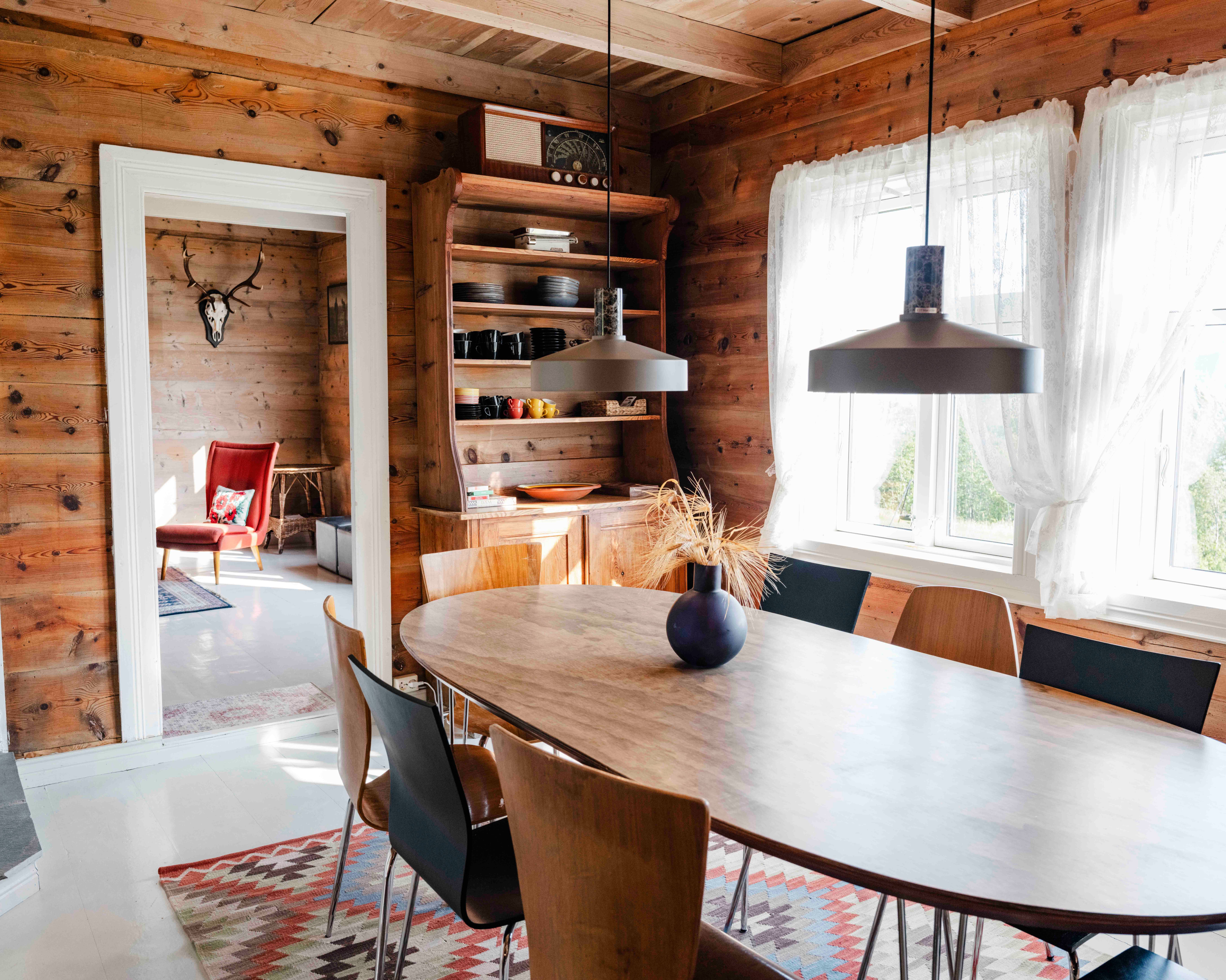 Spacious dining room with a scenic view and traditional charm at Stigen Fjordlodge.