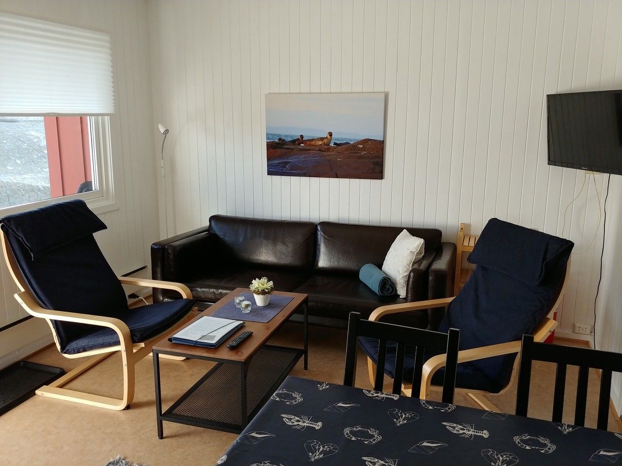 Living room with sofa, coffee table and armchairs