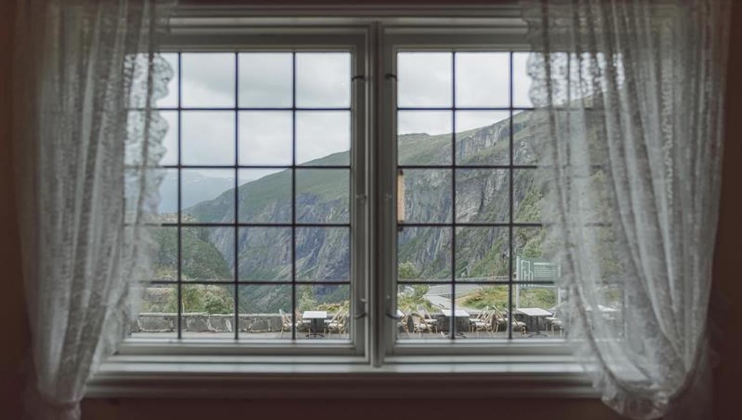 View through a hotel window towards the Måbødalen valley.