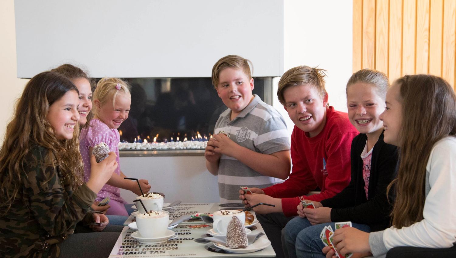 Kids enjoying hot chocolate and desserts at Stasjonen Cafe & Restaurant