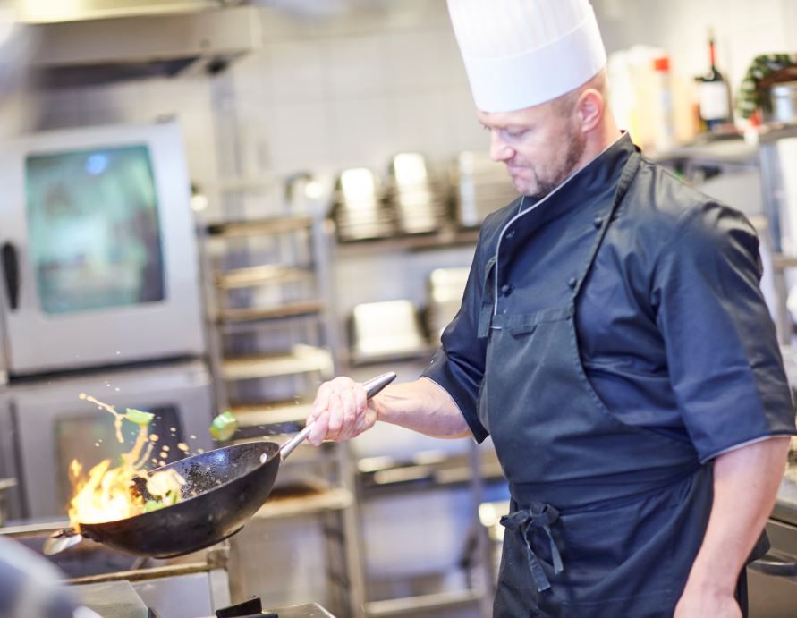 The cook is making food