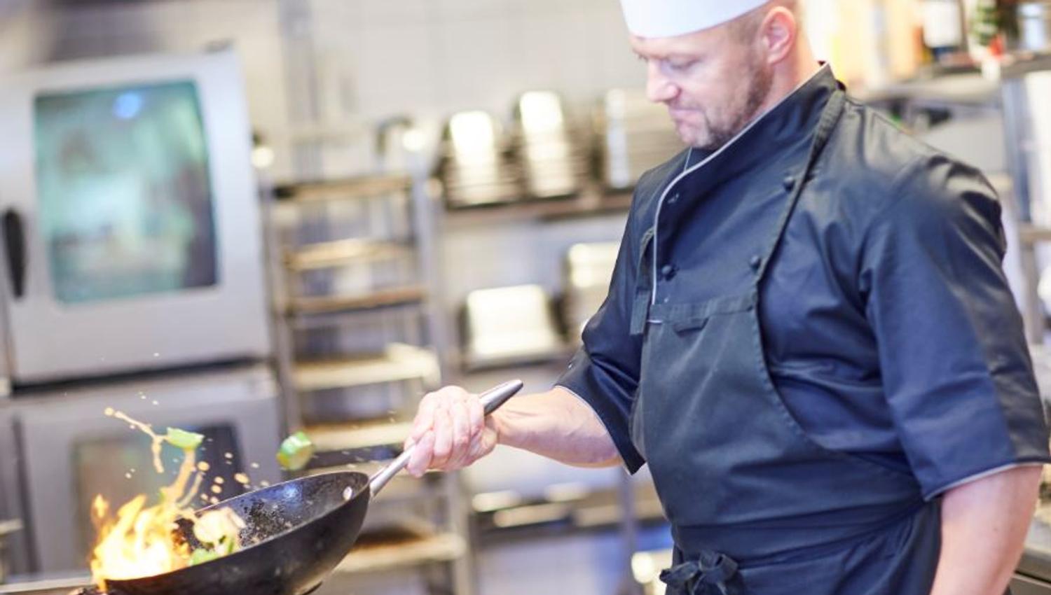 The cook is making food
