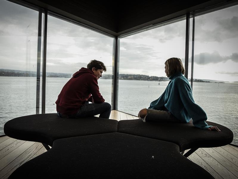 Two children at the window out to the Oslo Fjord