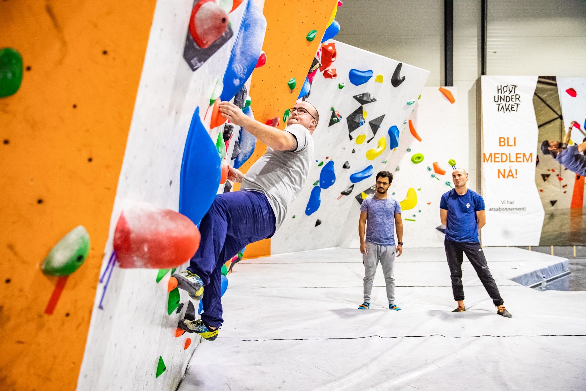 People climb in the bouldering room