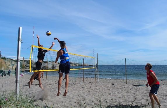 People play volleyball