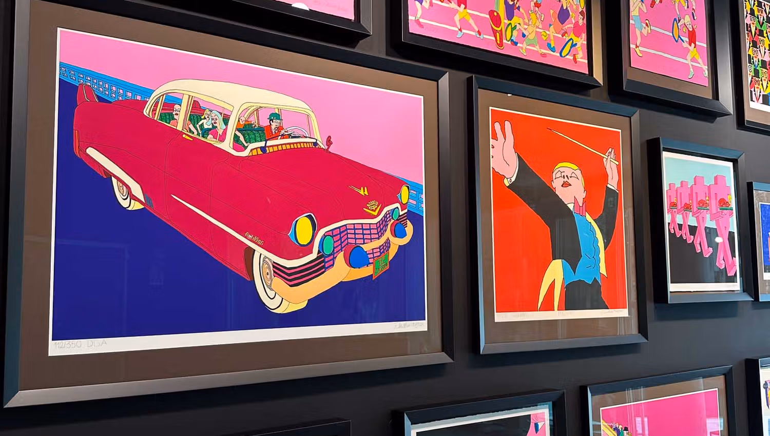 Various pictures displayed on a wall