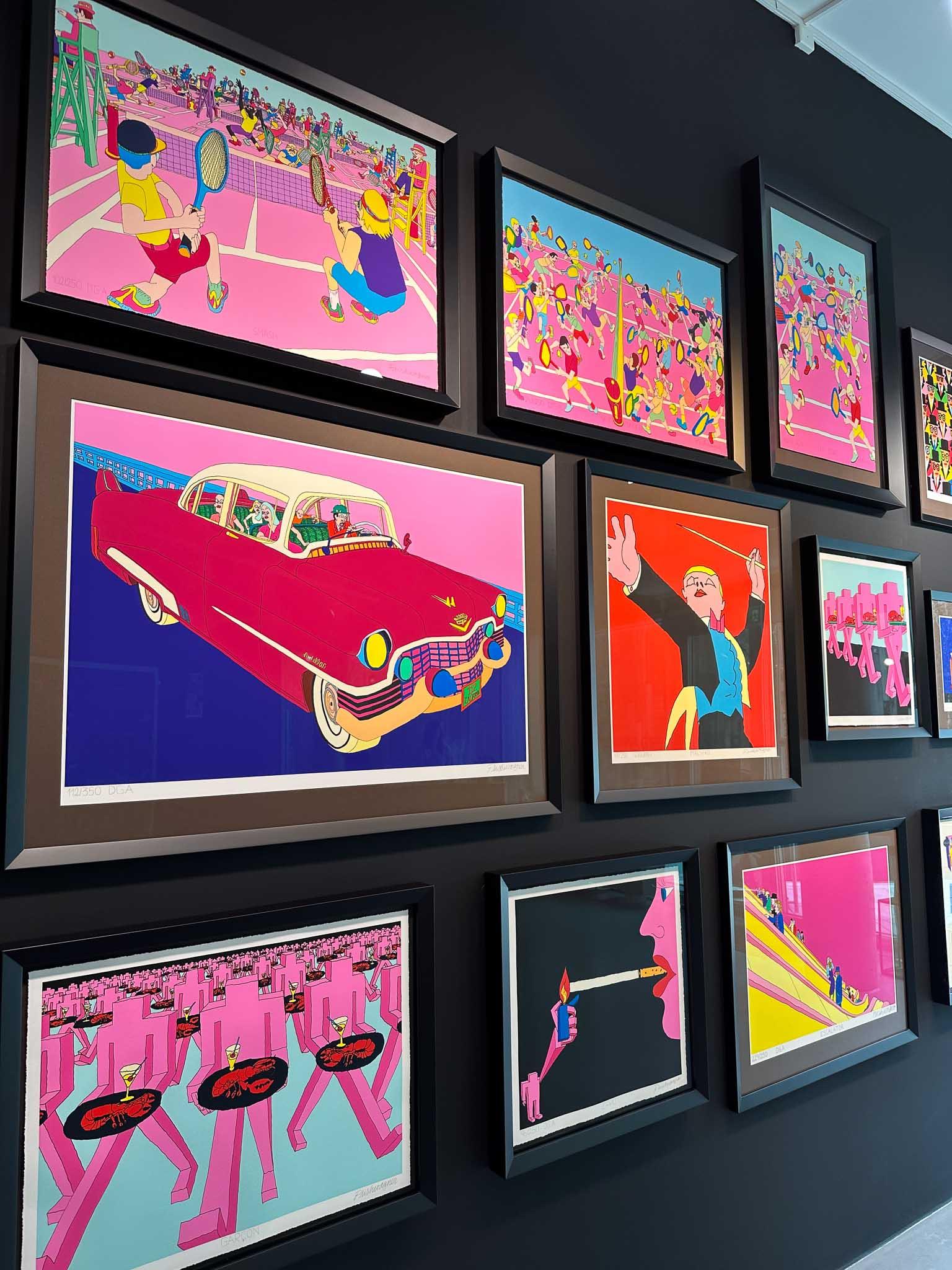 Various pictures displayed on a wall
