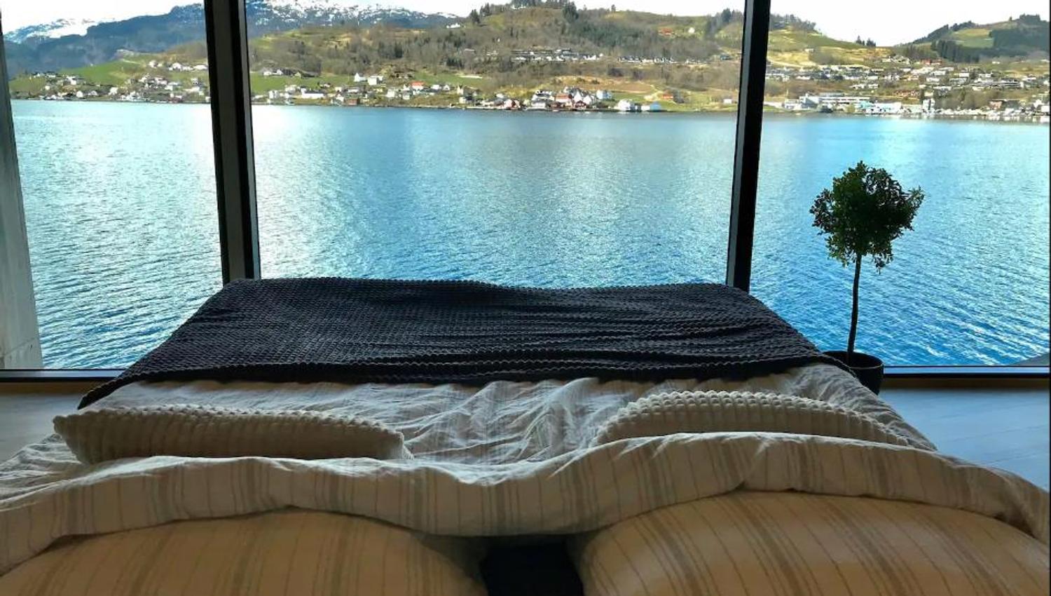 Wake up to a stunning view of the Hardangerfjord right from your bed.