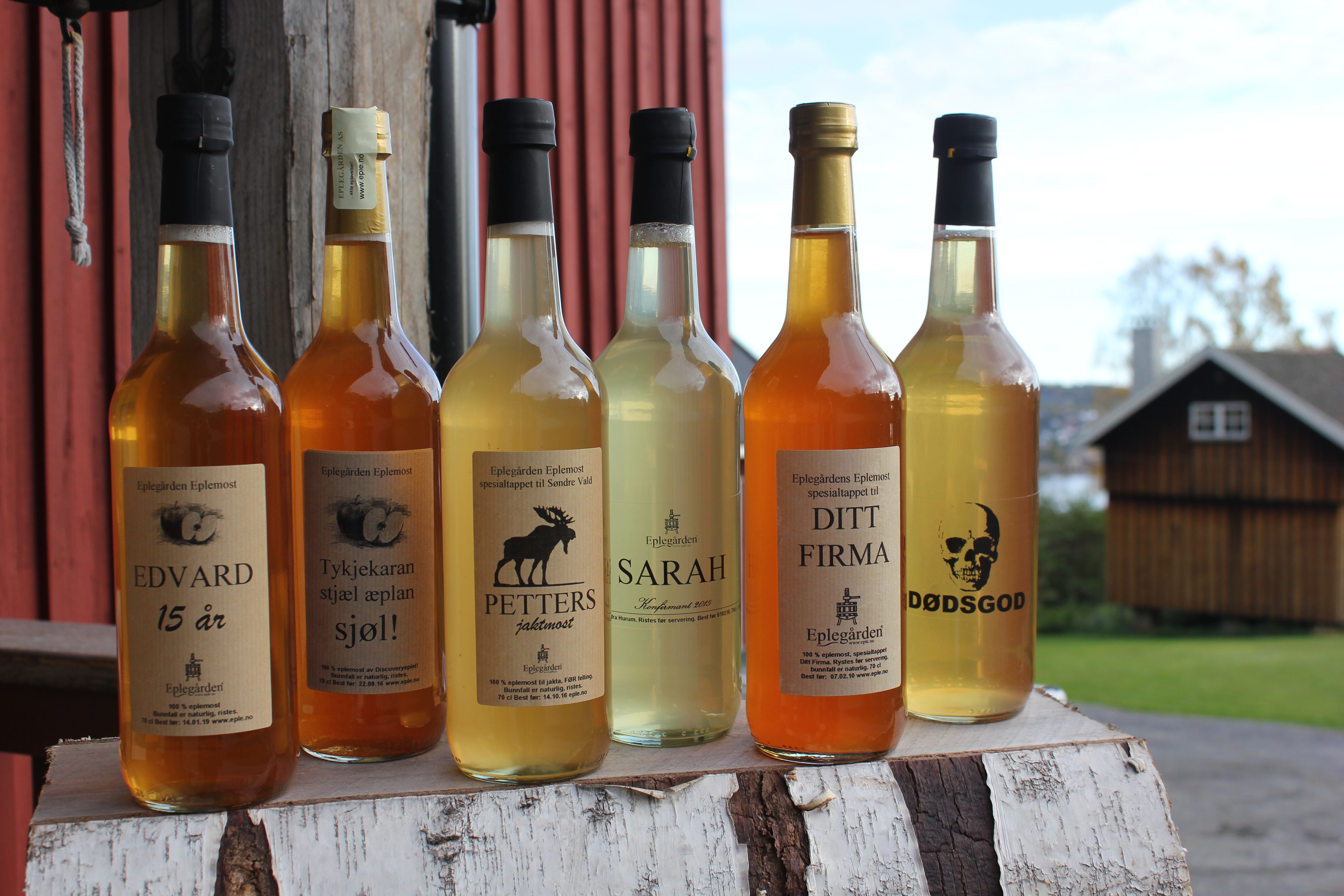 Bottles of apple juice with customised labels.