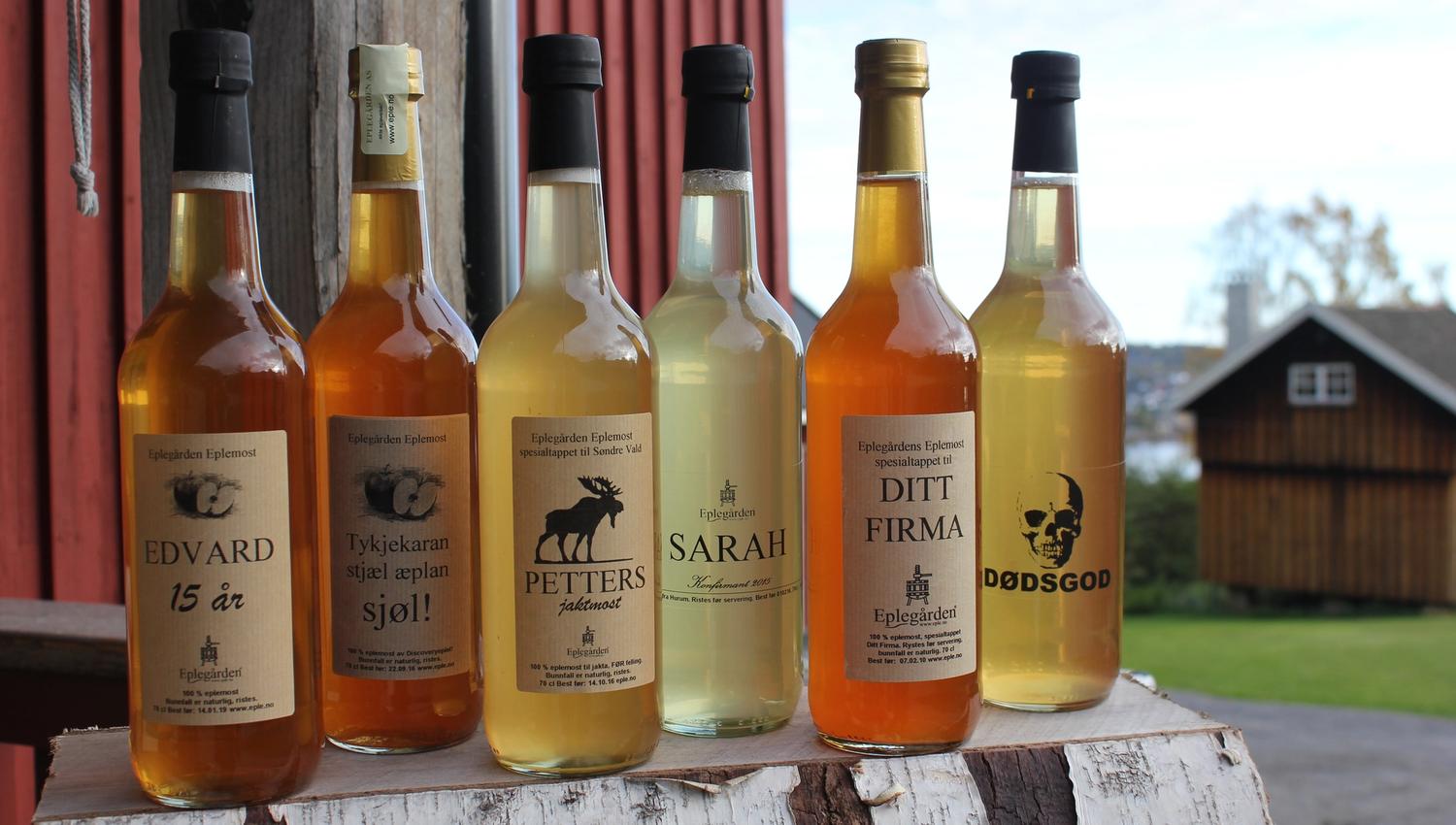 Bottles of apple juice with customised labels.